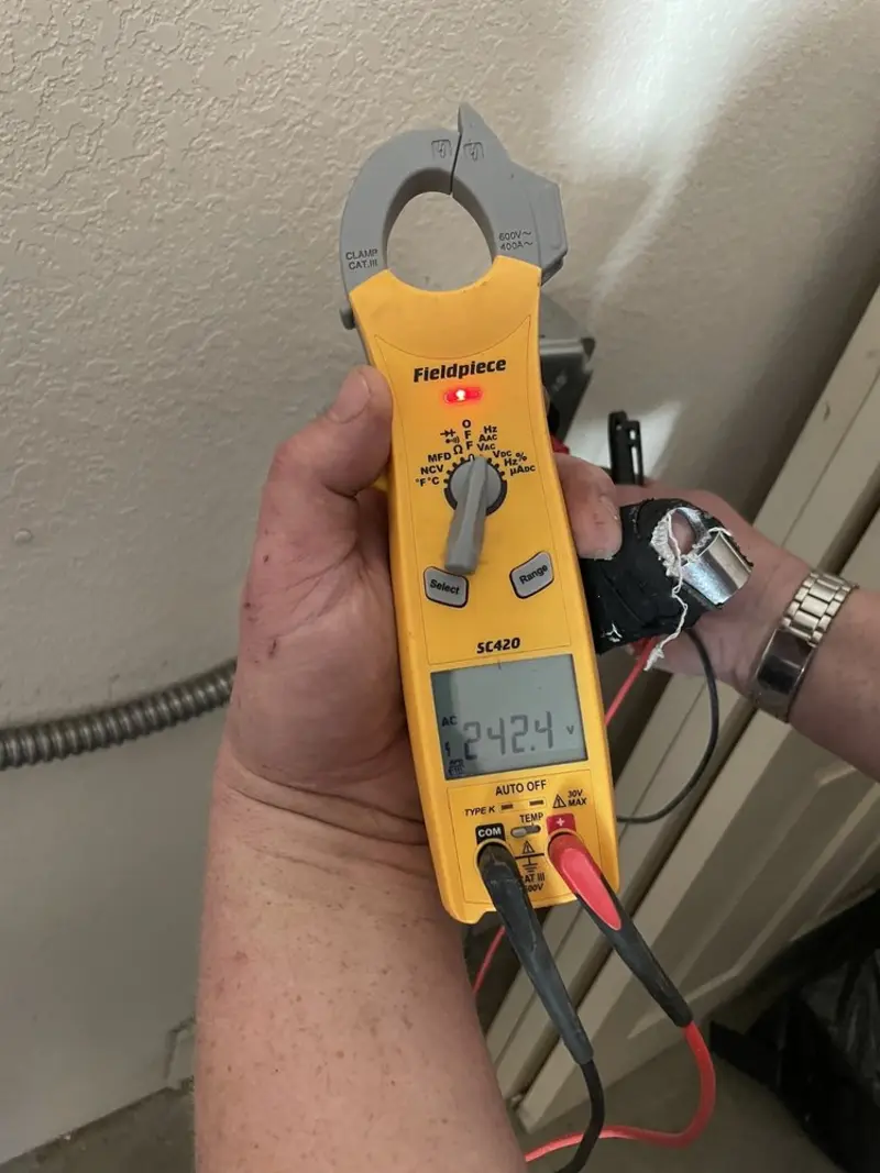 Voltage testing with clamp meter during Ceiling Fan Installation in Warrenville